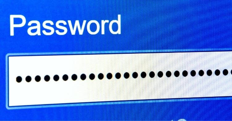 Microsoft Edge browser window open on a laptop with a security warning overlay, representing exposed password credentials in memory.