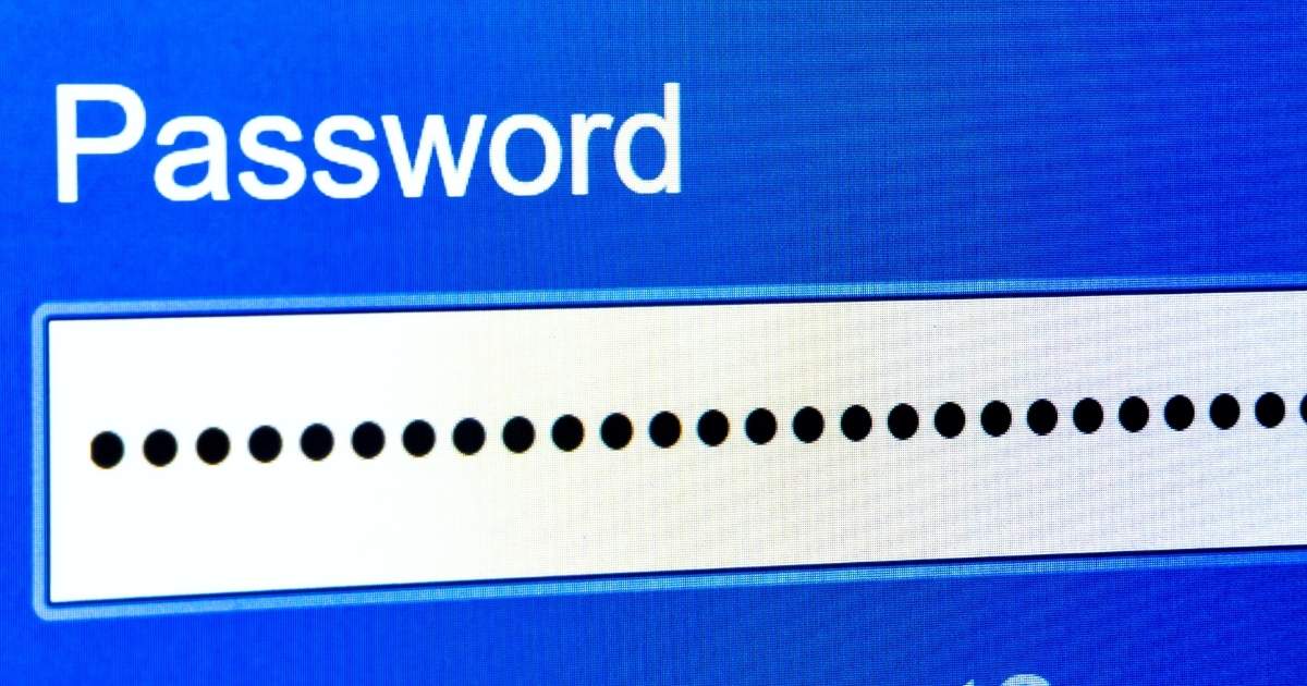 Microsoft Edge browser window open on a laptop with a security warning overlay, representing exposed password credentials in memory.