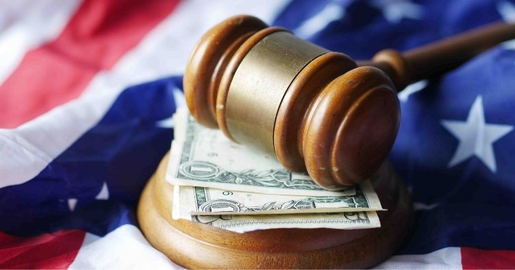 Gavel and legal documents representing False Claims Act enforcement for cybersecurity violations