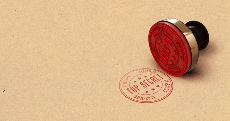 Top secret, confidential stamp place on brown paper