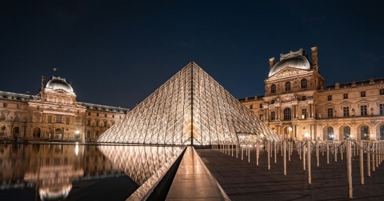 The louvre museum in Paris, France at night